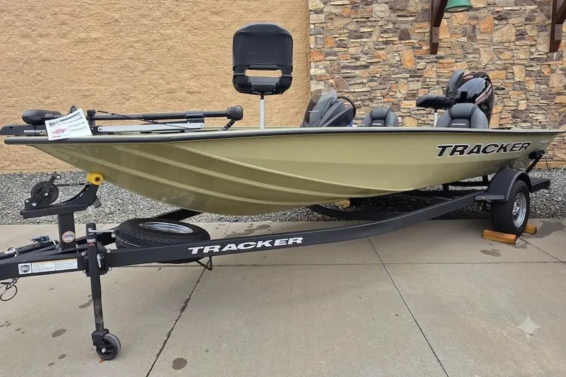 The Image of 2026 Tracker Pro Team 195 fishing boat on trailer, parked outdoors. - 0