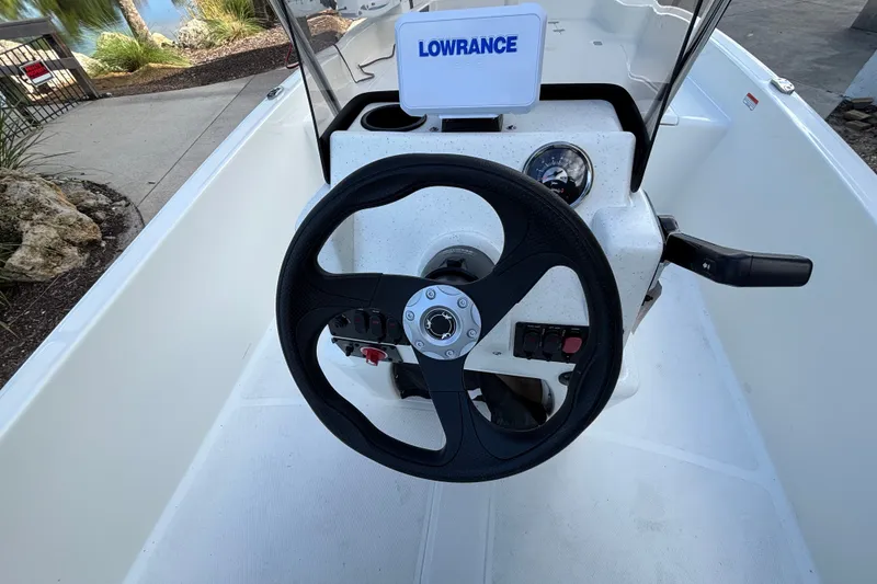Slide: The Image of Steering console of 2026 Mako Pro Skiff 17 CC with Lowrance display. - 12