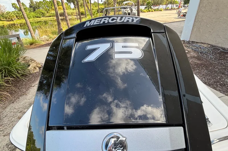 Slide: The Image of 2026 Mako Pro Skiff 17 CC with Mercury 75 engine, outdoor setting. - 4