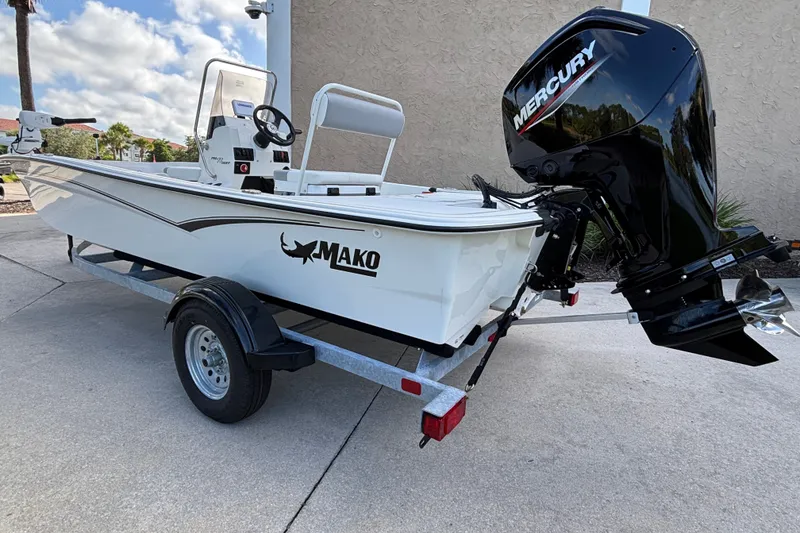 Slide: The Image of 2026 Mako Pro Skiff 17 CC boat on trailer with Mercury outboard motor. - 5