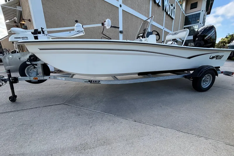 Slide: The Image of 2026 Mako Pro Skiff 17 CC boat on trailer, featuring Minn Kota motor. - 6