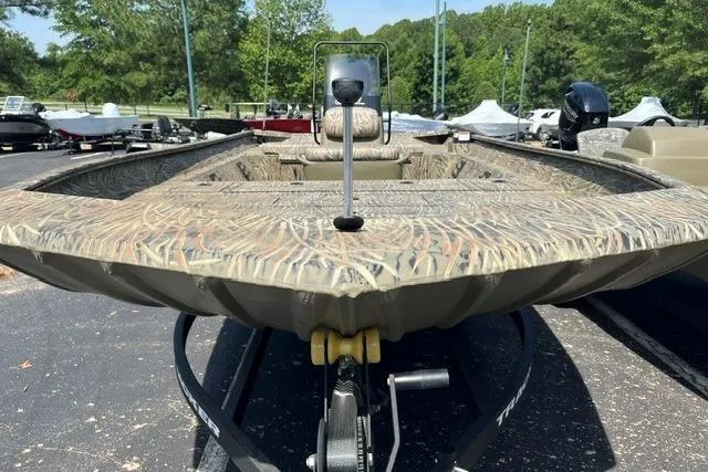 Slide: The Image of 2026 Tracker Grizzly 2072 CC boat with camouflage design on a trailer. - 2