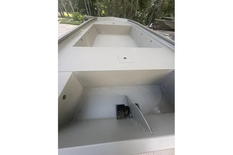Slide: The Image of 2026 Tracker Grizzly 1754 Utility boat interior, showcasing spacious and durable design. - 2