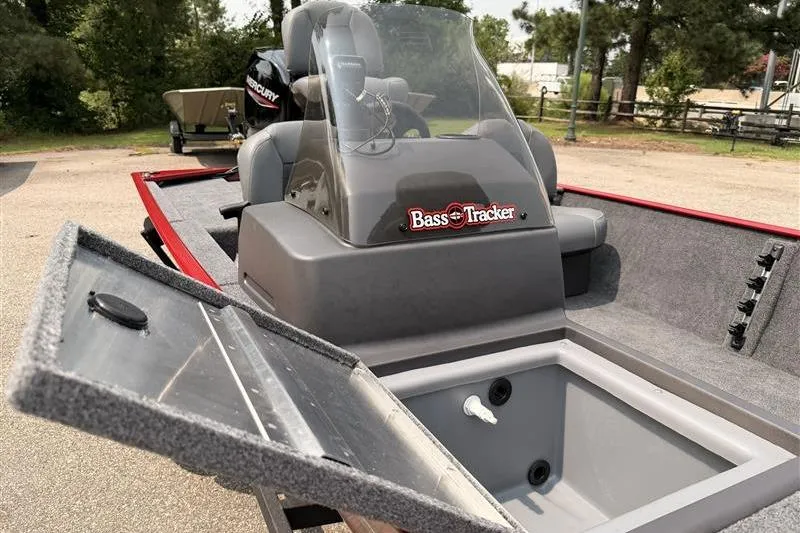 Slide: The Image of 2026 Tracker Bass Tracker Classic XL boat interior with open storage compartment. - 14