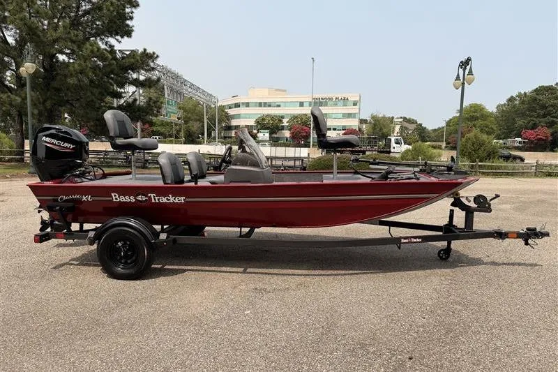 Slide: The Image of 2026 Tracker Bass Tracker Classic XL boat on trailer, parked outdoors. - 5