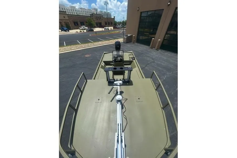 Slide: The Image of 2026 Tracker Grizzly 2072 CC Sportsman boat in parking lot, top view. - 4