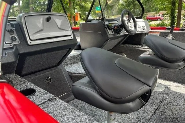 Slide: The Image of 2026 Tracker Pro Guide V-175 Combo boat interior with modern seating and dashboard. - 11