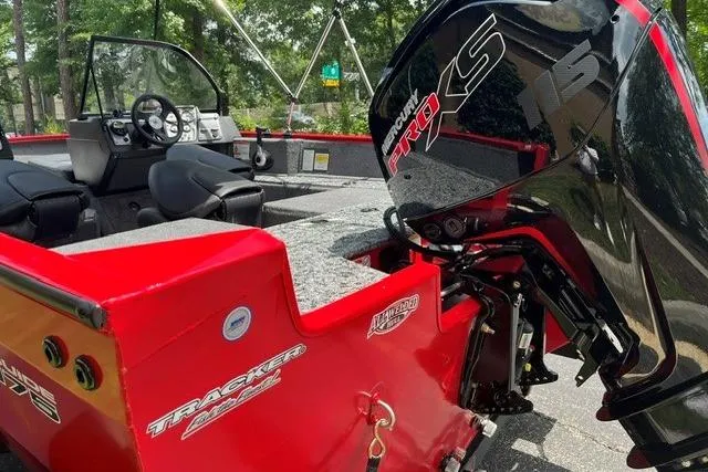 Slide: The Image of 2026 Tracker Pro Guide V-175 Combo boat with Mercury Pro XS engine, red exterior. - 9