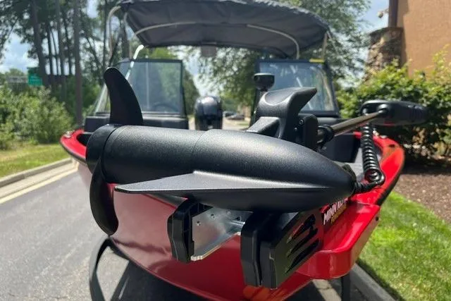 Slide: The Image of 2026 Tracker Pro Guide V-175 Combo boat with trolling motor, parked on a sunny day. - 2