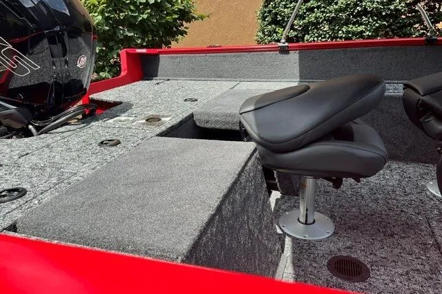 Slide: The Image of 2026 Tracker Pro Guide V-175 Combo boat interior with seating and motor. - 7