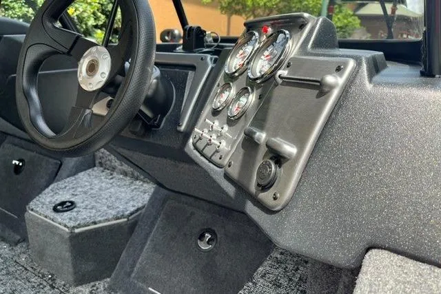 Slide: The Image of 2026 Tracker Pro Guide V-175 Combo dashboard with steering wheel and instrument panel. - 5