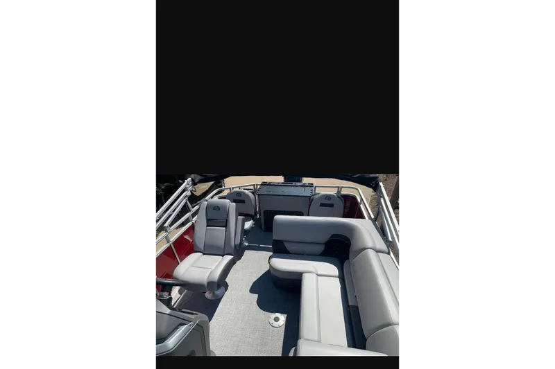 Slide: The Image of 2026 Sun Tracker SportFish 20 DLX interior with gray seating and spacious layout. - 87