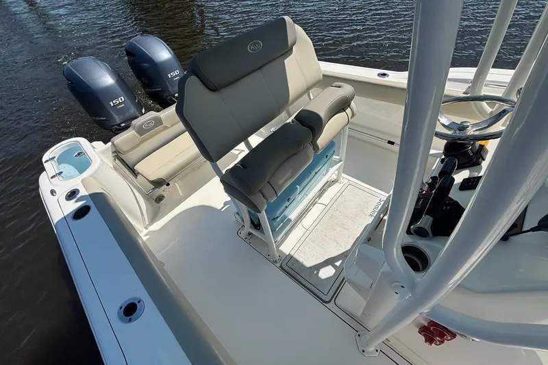 Slide: The Image of 2021 Key West 244 Center Console boat interior with dual engines and seating. - 10