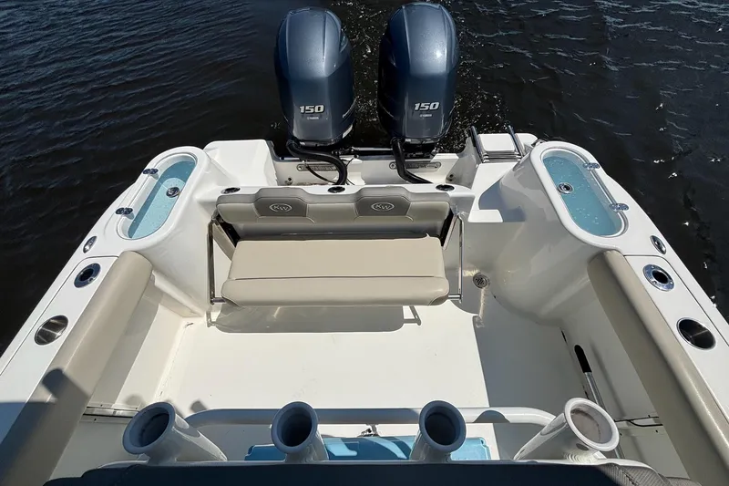 Slide: The Image of 2021 Key West 244 Center Console boat with dual 150 horsepower engines on water. - 11