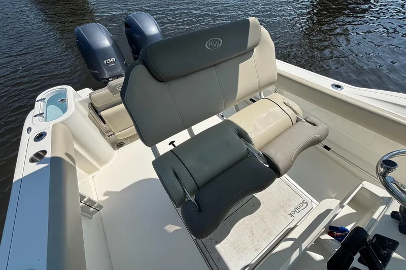 Slide: The Image of 2021 Key West 244 Center Console boat interior with dual Yamaha 150 engines. - 12
