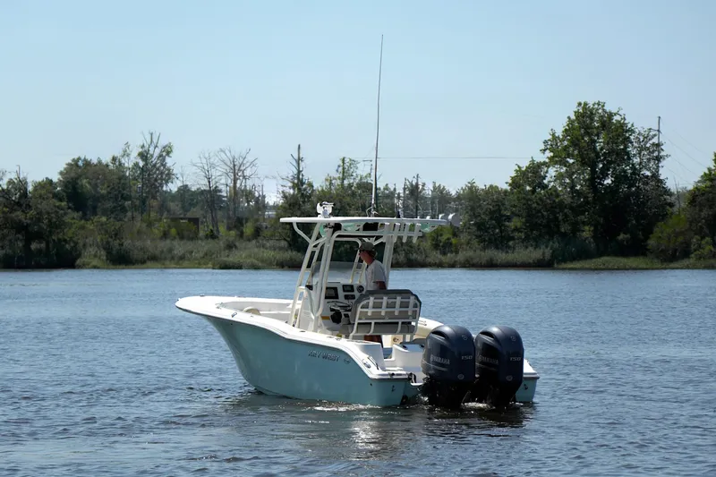 Slide: The Image of 2021 Key West 244 Center Console boat cruising on a calm lake. - 5