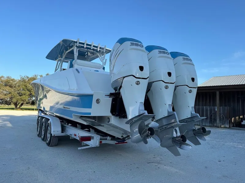 Slide: The Image of 2018 Concept 392 Family Edition boat with triple outboard engines on a trailer. - 6