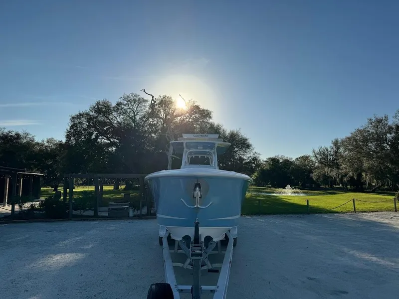Slide: The Image of Concept 392 Family Edition 2018 boat on trailer, sunny day, trees in background. - 8