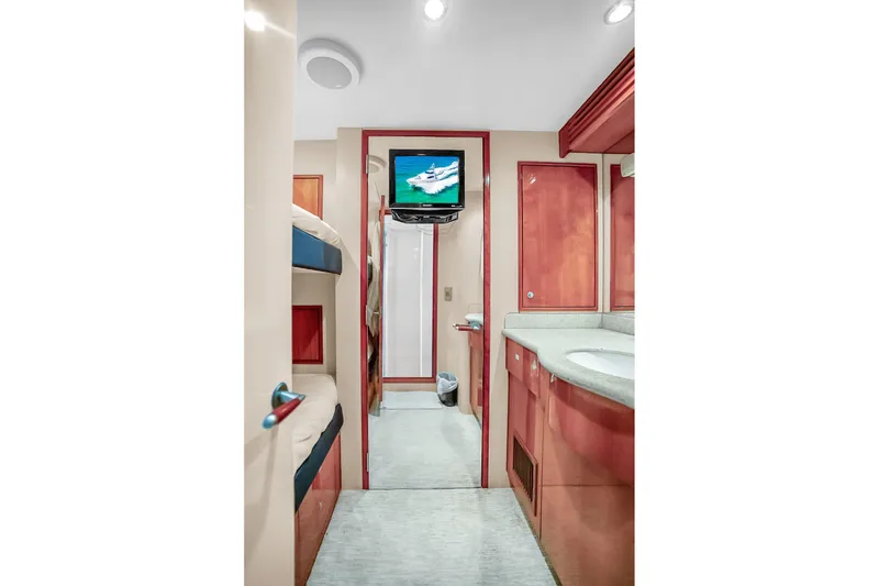 Slide: The Image of Interior of 2008 Hatteras 77 Convertible yacht with bunk beds and bathroom. - 104