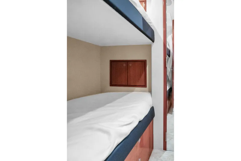 Slide: The Image of Bunk beds in 2008 Hatteras 77 Convertible yacht cabin interior. - 105