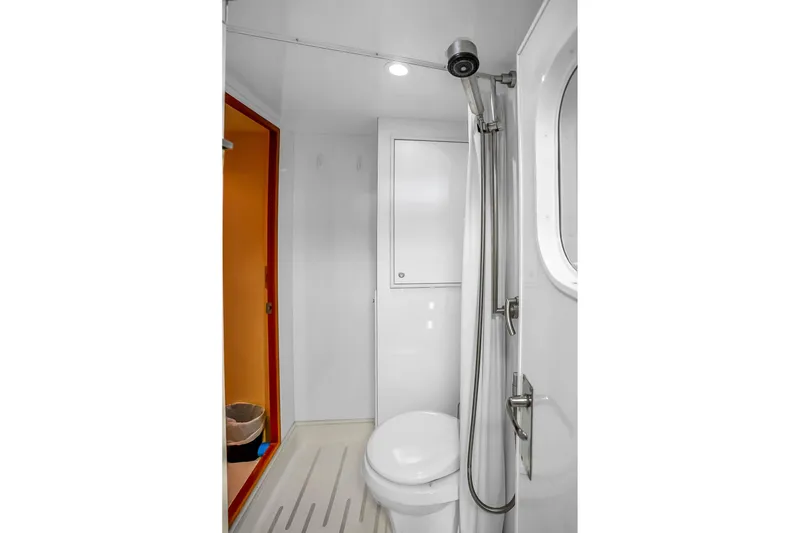 Slide: The Image of Bathroom interior of 2008 Hatteras 77 Convertible yacht, featuring shower and toilet. - 106