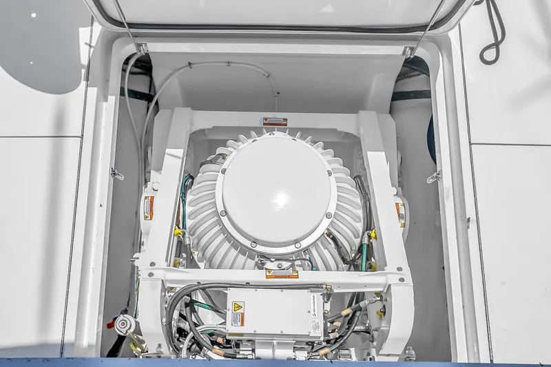 Slide: The Image of Engine compartment of 2008 Hatteras 77 Convertible yacht, showcasing mechanical components. - 107