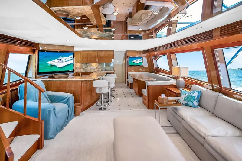 Slide: The Image of Luxurious interior of 2008 Hatteras 77 Convertible yacht with elegant furnishings and ocean view. - 28
