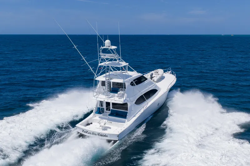 Slide: The Image of 2008 Hatteras 77 Convertible yacht cruising on open ocean waters. - 3