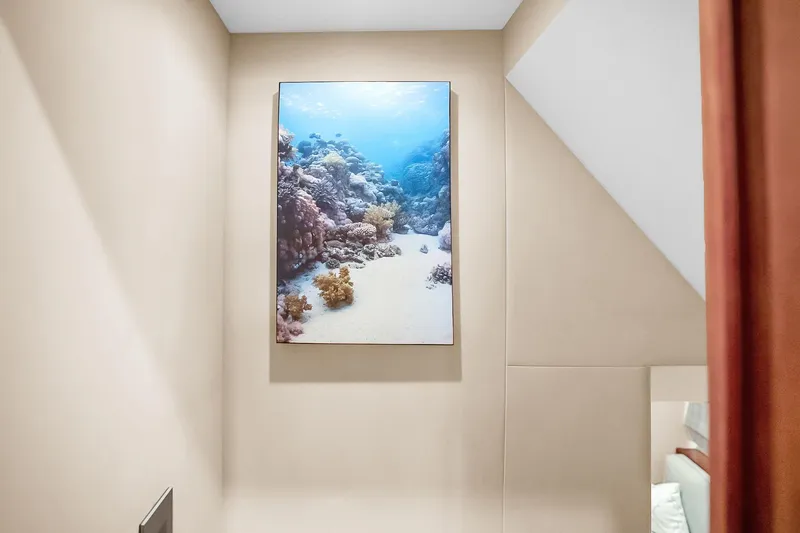 Slide: The Image of Interior of 2008 Hatteras 77 Convertible featuring ocean-themed wall art. - 50