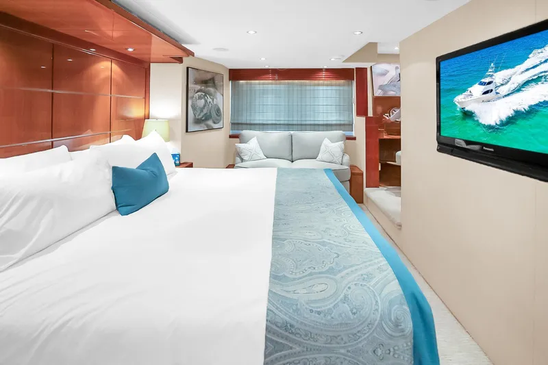 Slide: The Image of Luxurious bedroom interior of 2008 Hatteras 77 Convertible yacht with elegant decor and TV. - 51