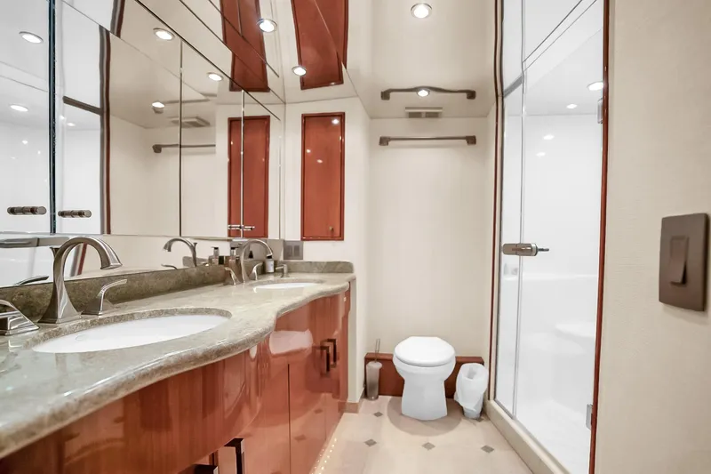 Slide: The Image of Luxurious bathroom in 2008 Hatteras 77 Convertible yacht with elegant fixtures and spacious shower. - 54
