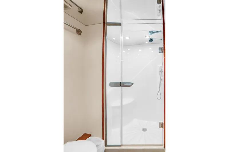 Slide: The Image of Luxurious shower in 2008 Hatteras 77 Convertible yacht, featuring sleek glass doors and modern fixtures. - 57