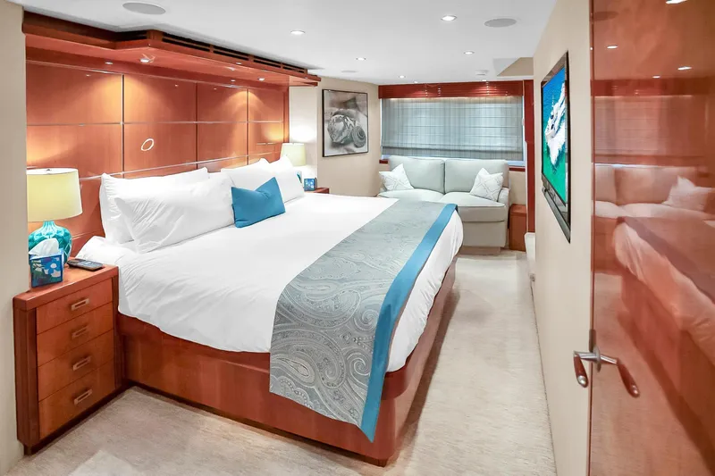 Slide: The Image of Luxurious bedroom interior of 2008 Hatteras 77 Convertible yacht with elegant furnishings. - 59