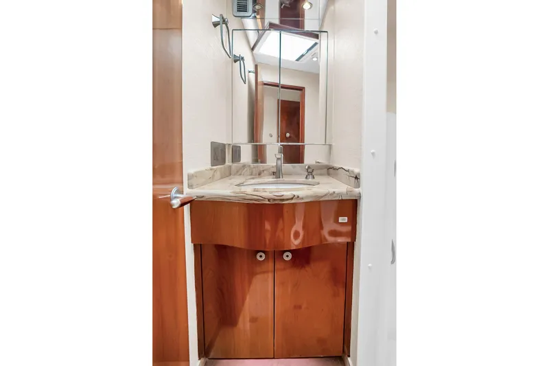 Slide: The Image of Luxurious bathroom vanity on 2008 Hatteras 77 Convertible yacht with marble countertop. - 66