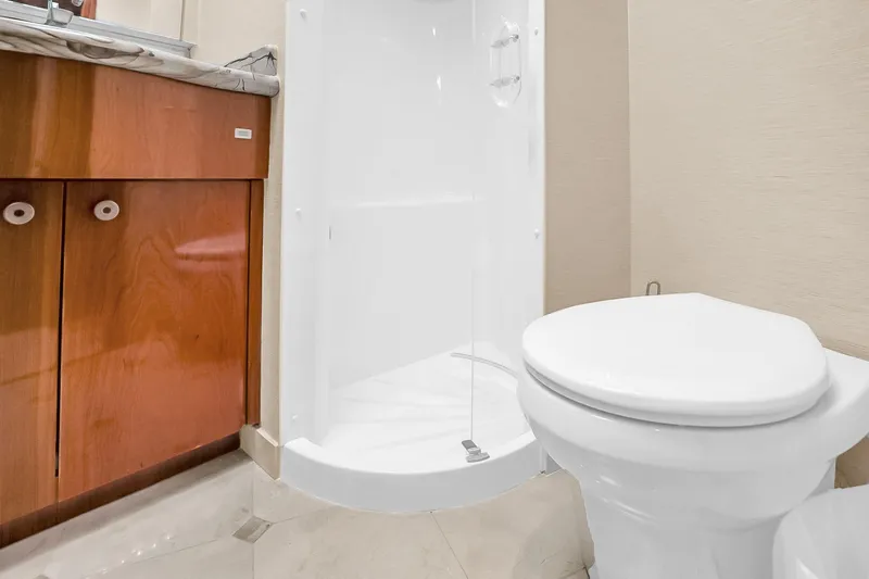 Slide: The Image of Bathroom interior of 2008 Hatteras 77 Convertible yacht with shower and toilet. - 67