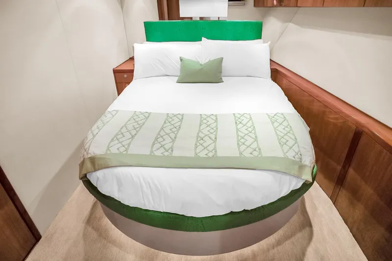 Slide: The Image of Luxurious bedroom interior on 2008 Hatteras 77 Convertible yacht with elegant bedding. - 72