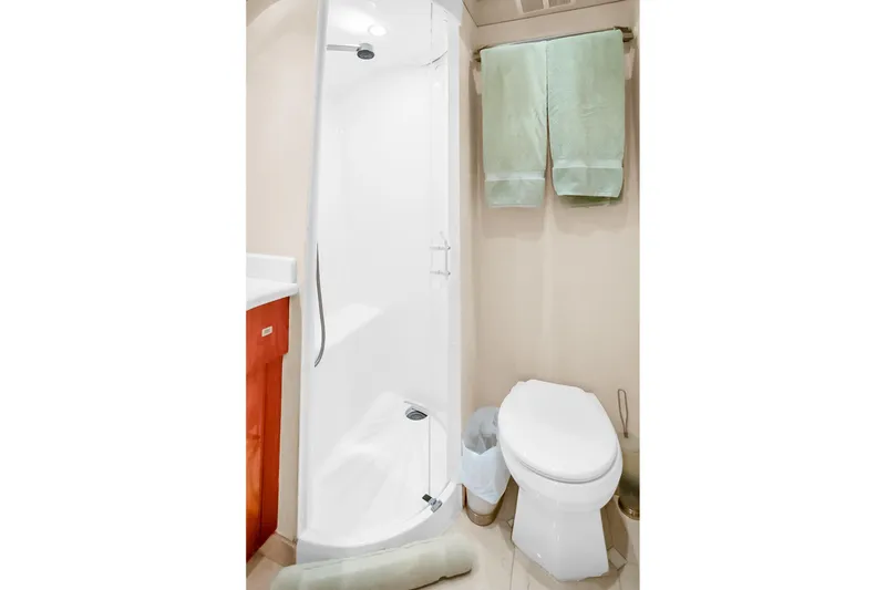 Slide: The Image of Bathroom interior of 2008 Hatteras 77 Convertible yacht with shower and toilet. - 74