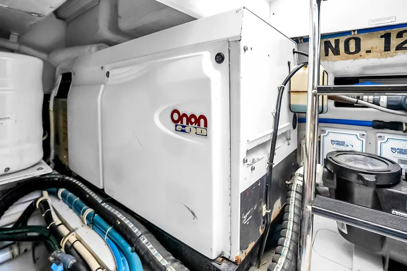 Slide: The Image of Engine room of 2008 Hatteras 77 Convertible with Onan generator and equipment. - 97