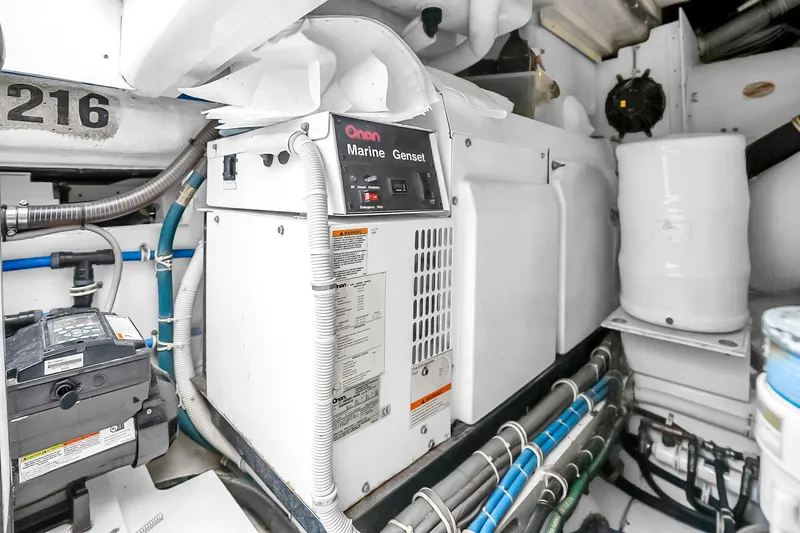 Slide: The Image of Engine room of 2008 Hatteras 77 Convertible with Onan Marine Genset. - 98