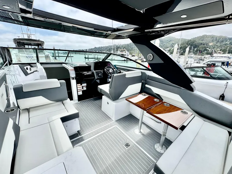 Slide: The Image of 2023 Cruisers Yachts 34 GLS I/O interior with sleek seating and modern design. - 24