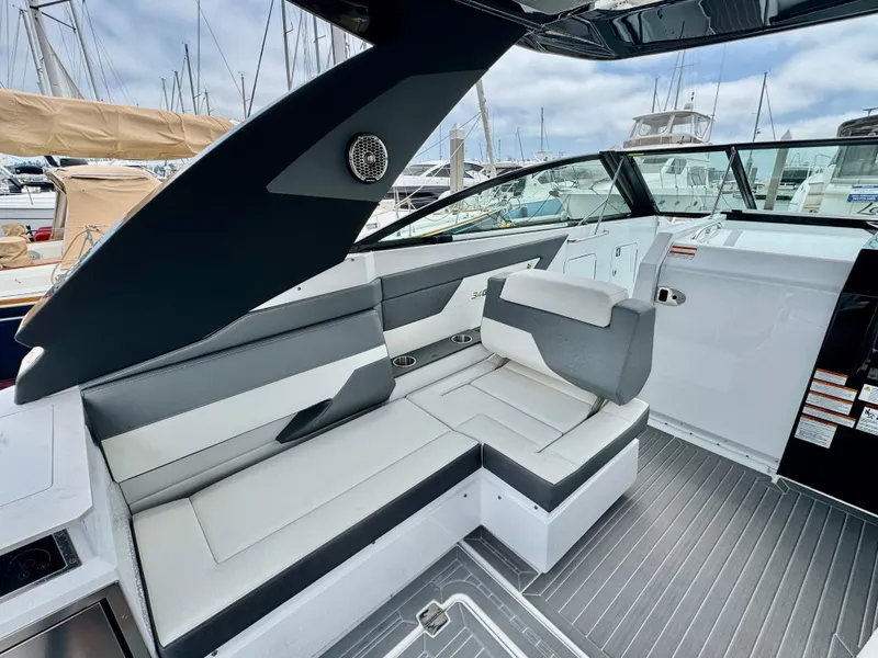 Slide: The Image of 2023 Cruisers Yachts 34 GLS I/O interior with sleek seating and modern design. - 27