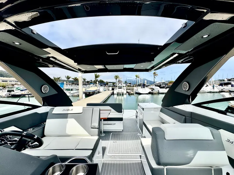Slide: The Image of 2023 Cruisers Yachts 34 GLS I/O interior with sleek design at marina. - 37
