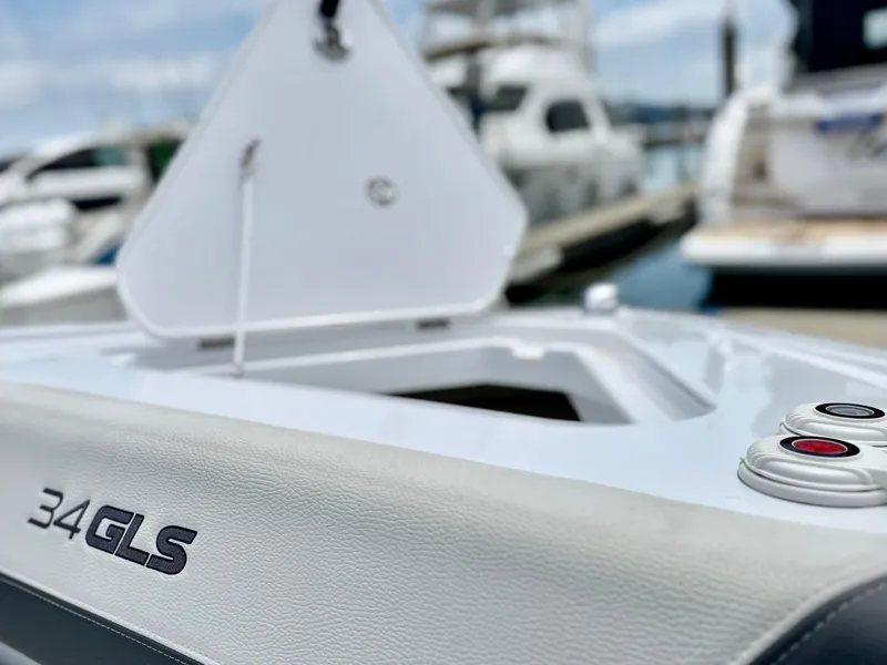Slide: The Image of 2023 Cruisers Yachts 34 GLS I/O boat detail at marina, showcasing sleek design. - 46