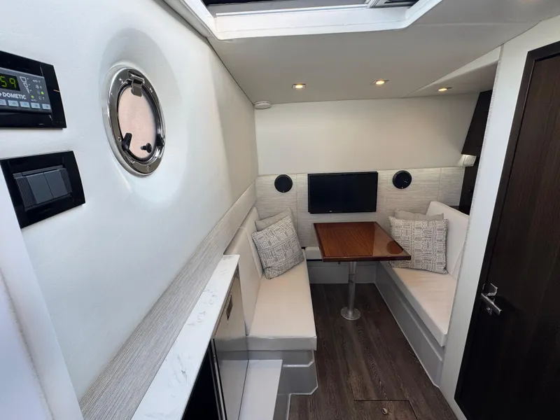 Slide: The Image of 2023 Cruisers Yachts 34 GLS I/O interior with cozy seating and modern decor. - 51