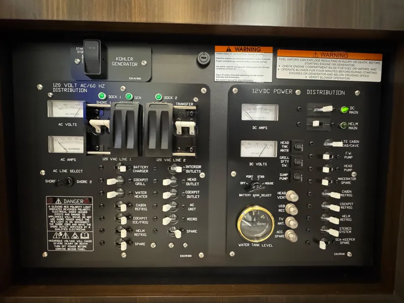 Slide: The Image of Electrical control panel of 2023 Cruisers Yachts 34 GLS I/O, featuring switches and gauges. - 58