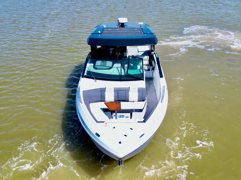 Slide: The Image of 2023 Cruisers Yachts 34 GLS I/O on water, aerial view. - 6