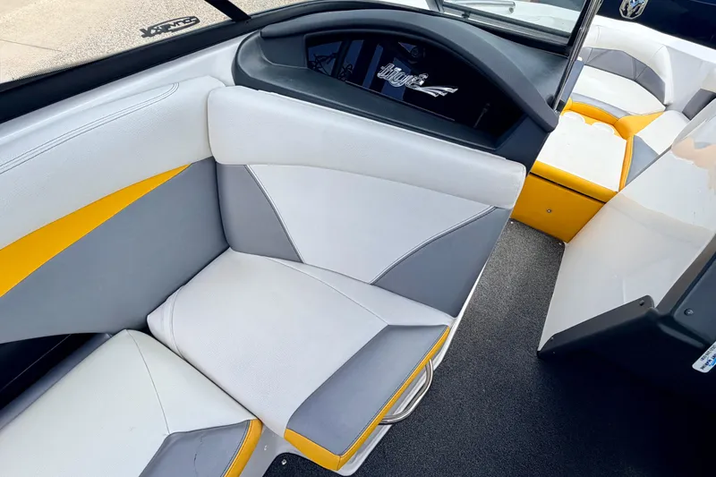 Slide: The Image of 2014 Tigé R20 boat interior with white, gray, and yellow seating. - 40