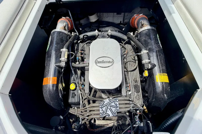 Slide: The Image of Engine compartment of a 2014 Tigé R20 boat with visible engine. - 30