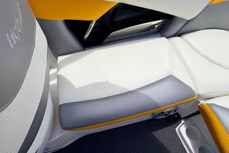 Slide: The Image of 2014 Tigé R20 boat interior with white, gray, and yellow seating. - 31