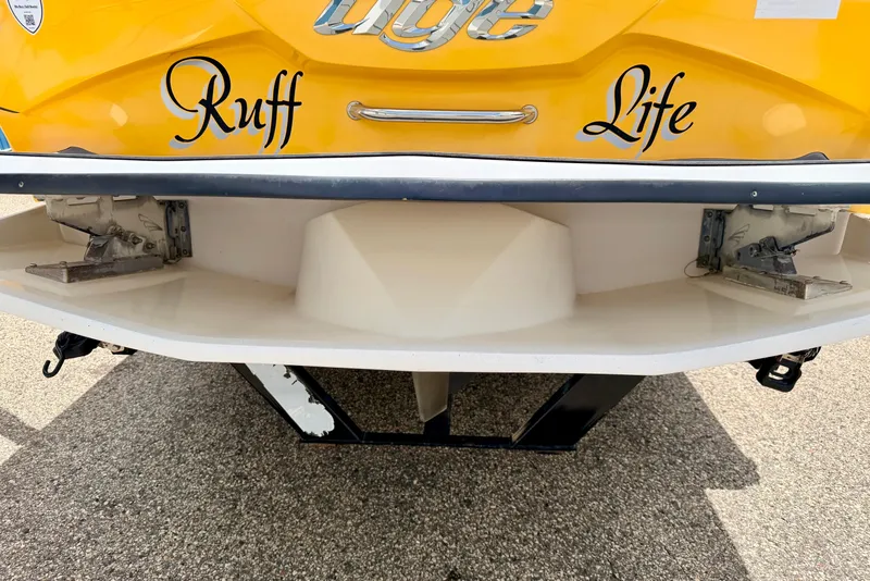 Slide: The Image of Yellow 2014 Tigé R20 boat with "Ruff Life" text on the stern. - 19